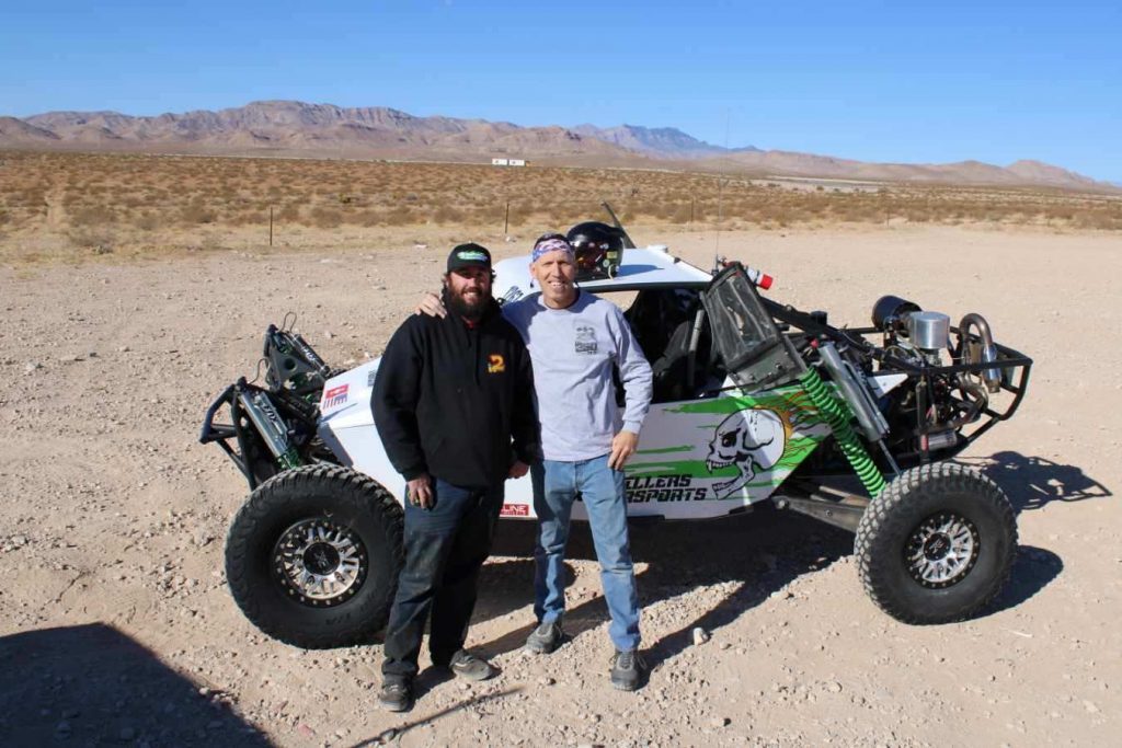 Chief Mechanic Billy Shapley, left, is seen with fellow off-road racer, John Pellissier, who is prepared to is ready to compete Dec. 10-13. Pellissier and car owner Richard Seibel Rud are celebrating the 30th anniversary of their first race together which was the 1990 SNORE Showboat 250 debuting the new car.